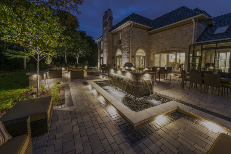 An outdoor space with custom lighting and stone features