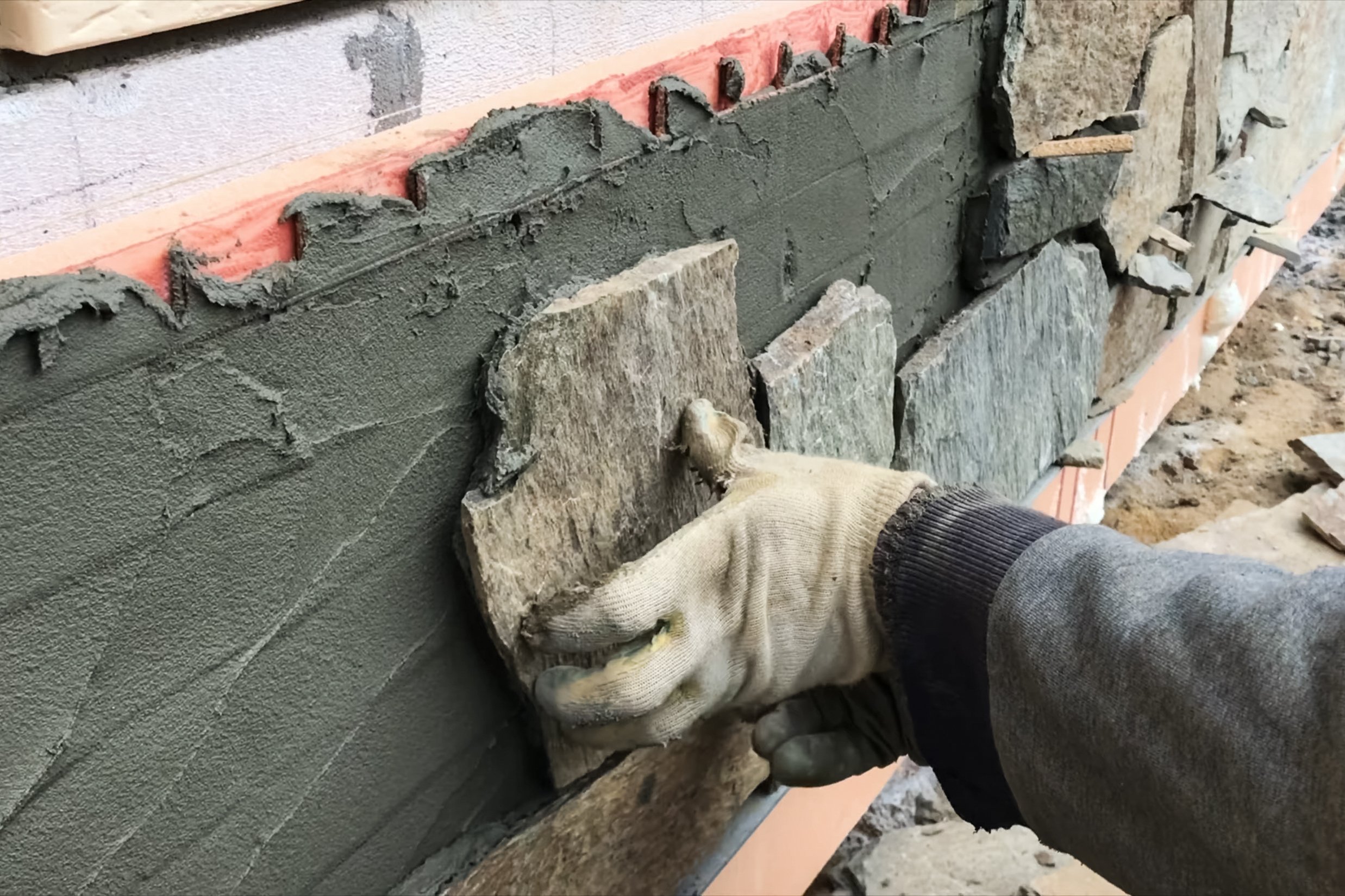 A square sample of gray stone with a smooth surface and subtle veins and variations in color.